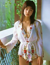 Dreamy gravure angel is simply adorable in a yellow bikini